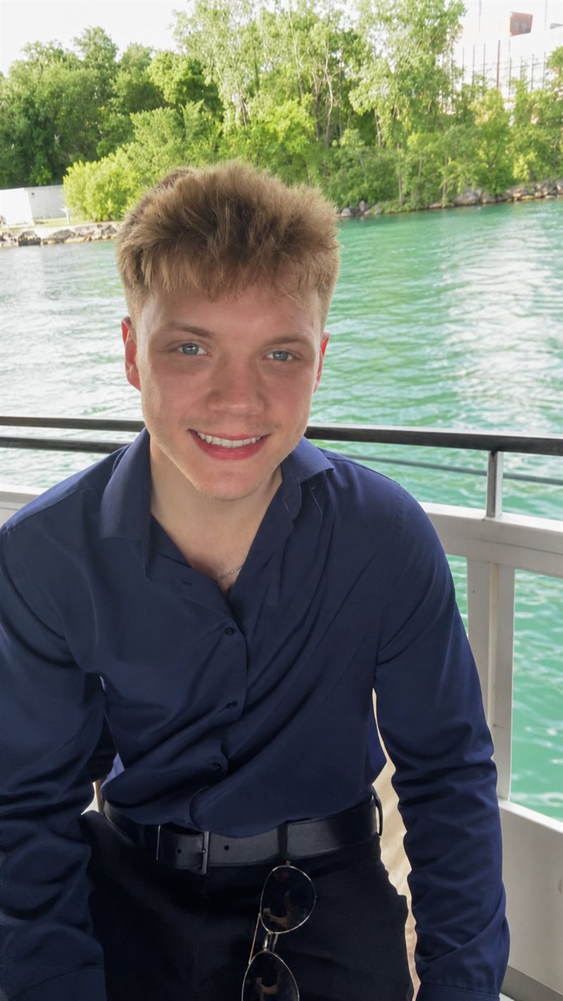 Hunter Moore, founder of Fixday Studio, on a boat
